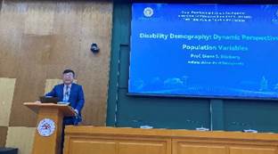 A person standing at a podium

Description automatically generated